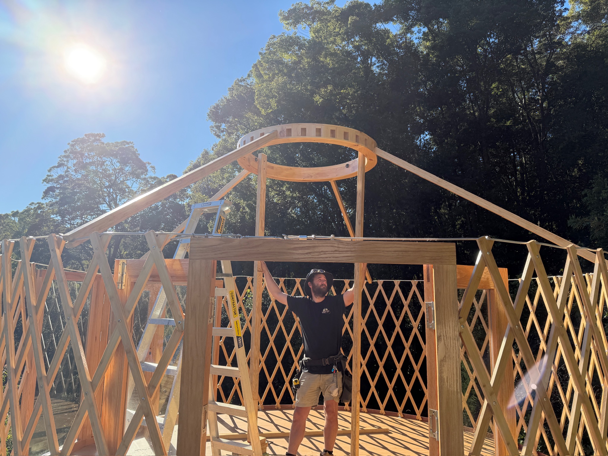 Lattice walls and rafters going up during a build