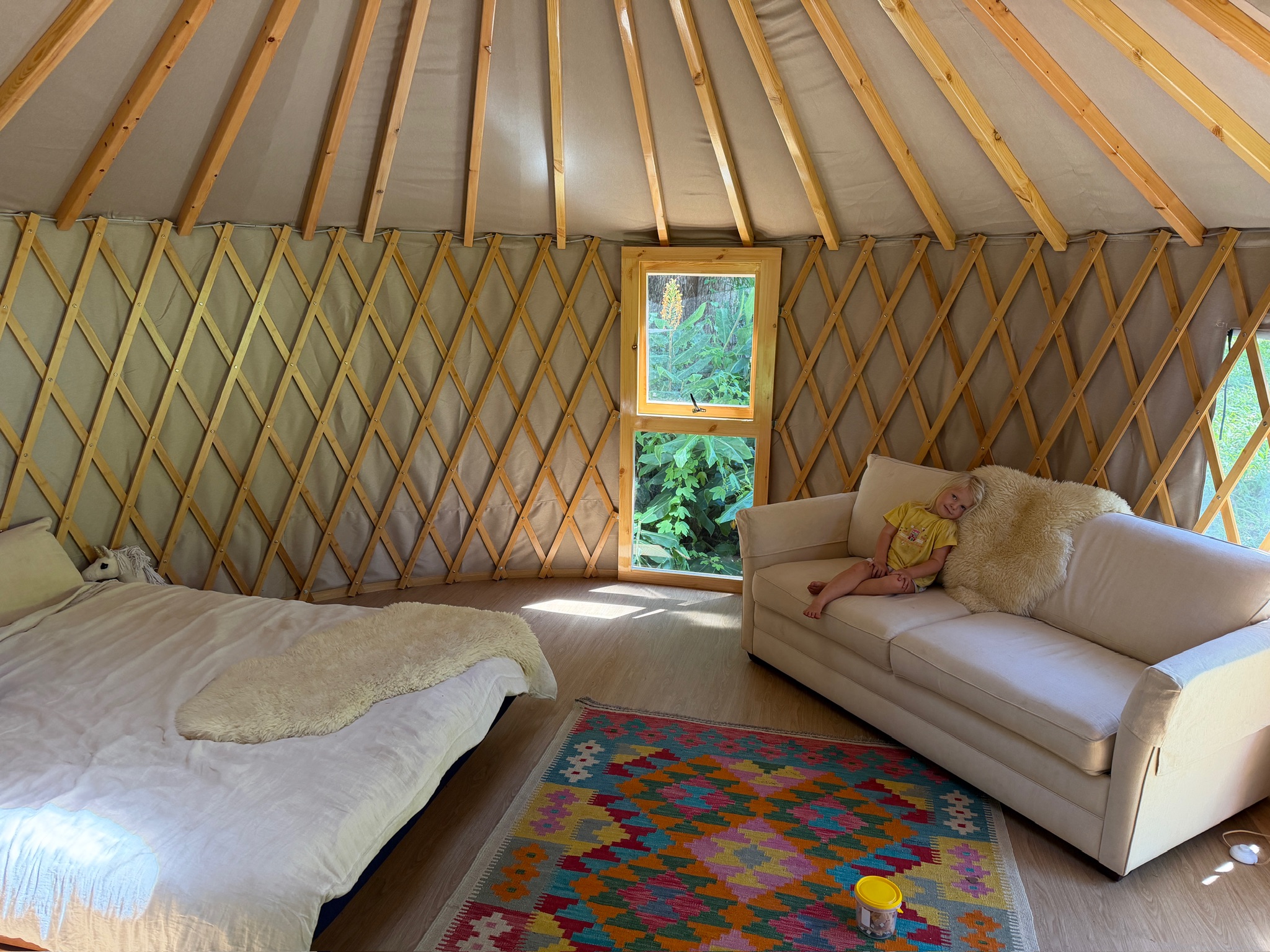 Furnished yurt interior showing comfortable permanent year-round living